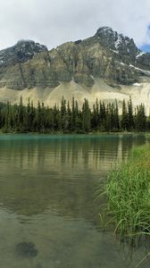 Preview wallpaper glacial lake, alberta, canada, mountains, trees, grass