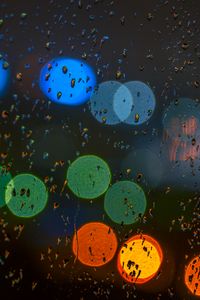 Preview wallpaper glare, colorful, drops, glass, rain