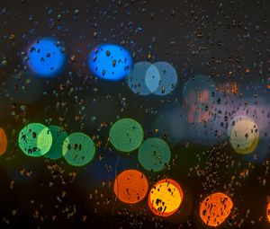 Preview wallpaper glare, colorful, drops, glass, rain