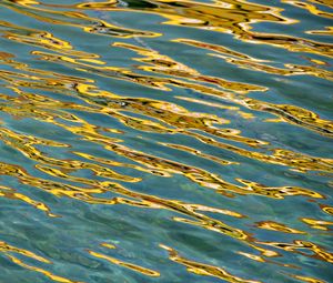Preview wallpaper glare, water, ripples, golden, waves