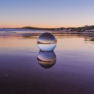 Preview wallpaper glass ball, ball, lake, reflection, sunset