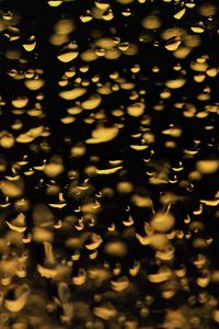 Preview wallpaper glass, drops, backlight, yellow, dark, macro