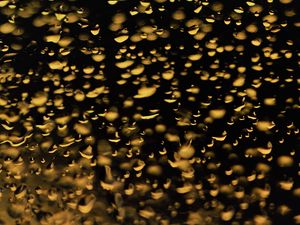 Preview wallpaper glass, drops, backlight, yellow, dark, macro