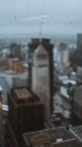 Preview wallpaper glass, drops, city, buildings, wet, macro