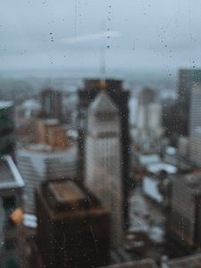 Preview wallpaper glass, drops, city, buildings, wet, macro