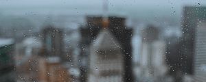 Preview wallpaper glass, drops, city, buildings, wet, macro
