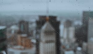 Preview wallpaper glass, drops, city, buildings, wet, macro