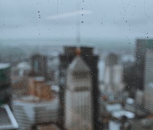 Preview wallpaper glass, drops, city, buildings, wet, macro