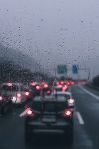 Preview wallpaper glass, drops, rain, blur, cars, road