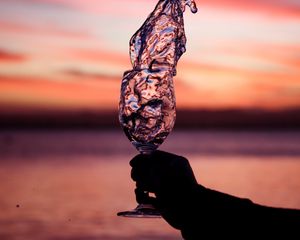 Preview wallpaper glass, splash, spray, hand, sunset