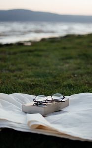 Preview wallpaper glasses, book, grass, relax
