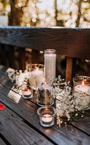 Preview wallpaper glasses, candles, flowers, table