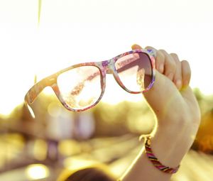 Preview wallpaper glasses, hands, sunlight