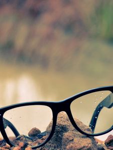 Preview wallpaper glasses, lenses, rocks, grass, rose