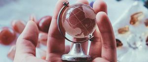 Preview wallpaper globe, souvenir, hand, glass