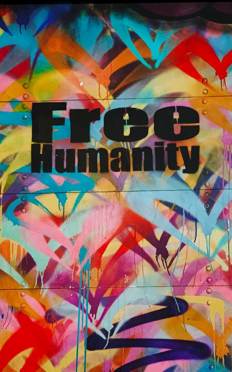 800x1280 Wallpaper graffiti, freedom, humanity, colorful, wall