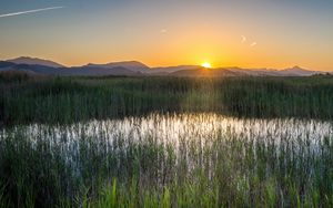 Preview wallpaper grass, field, mountains, sunrise, landscape