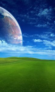 Preview wallpaper grass, greens, field, lawn, sky, planets, space, clouds