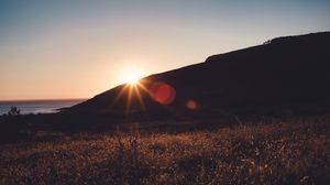 Preview wallpaper grass, horizon, sunset, sky, landscape