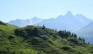 Preview wallpaper grass, slope, mountains, stones, nature