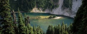 Preview wallpaper grass, slope, trees, island, mountains