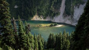 Preview wallpaper grass, slope, trees, island, mountains