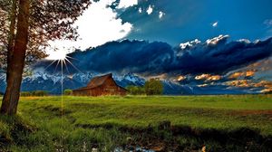 Preview wallpaper grass, trees, field, river, sky, clouds, building