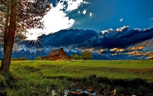 Preview wallpaper grass, trees, field, river, sky, clouds, building