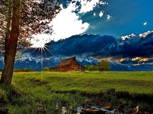 Preview wallpaper grass, trees, field, river, sky, clouds, building