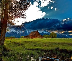 Preview wallpaper grass, trees, field, river, sky, clouds, building