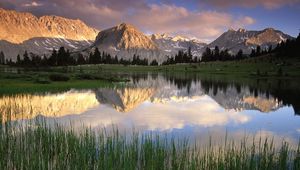 Preview wallpaper grass, water, mountains, sunlight, shade, morning