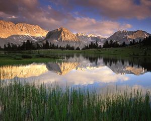 Preview wallpaper grass, water, mountains, sunlight, shade, morning