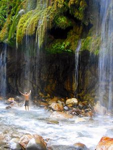 Preview wallpaper greece, falls, rocks, guy, back, stones