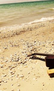 Preview wallpaper guitar, beach, coast, sand, stones, romanticism