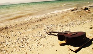 Preview wallpaper guitar, beach, coast, sand, stones, romanticism