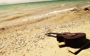 Preview wallpaper guitar, beach, coast, sand, stones, romanticism