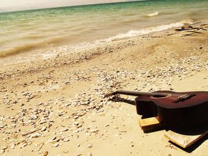 Preview wallpaper guitar, beach, coast, sand, stones, romanticism