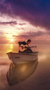 Preview wallpaper guitar, guitarist, boat, sea, sunset, horizon, musician