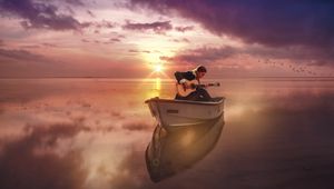 Preview wallpaper guitar, guitarist, boat, sea, sunset, horizon, musician