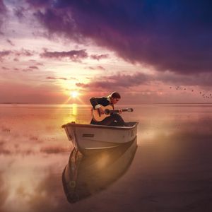 Preview wallpaper guitar, guitarist, boat, sea, sunset, horizon, musician