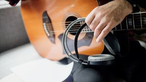 Preview wallpaper guitar, guitarist, headphones, music