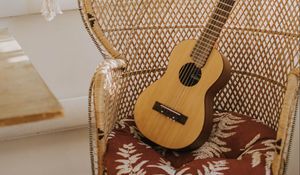 Preview wallpaper guitar, musical instrument, armchair, brown