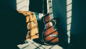 Preview wallpaper guitar, musical instrument, brown, dark, shadow