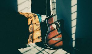 Preview wallpaper guitar, musical instrument, brown, dark, shadow