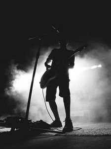 Preview wallpaper guitarist, musician, concert, microphone, performance, smoke, black and white