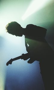 Preview wallpaper guitarist, silhouette, light, guitar