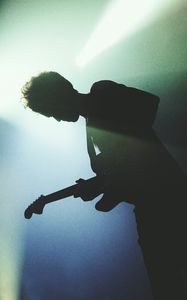 Preview wallpaper guitarist, silhouette, light, guitar