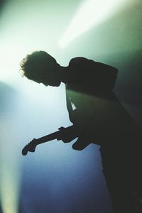 Preview wallpaper guitarist, silhouette, light, guitar