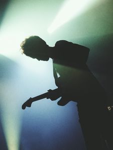 Preview wallpaper guitarist, silhouette, light, guitar