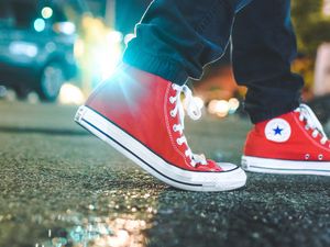 Preview wallpaper gumshoes, legs, asphalt, glare, red